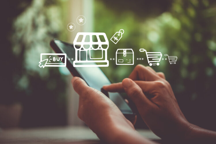Women hand using smartphone do online selling for people shopping online with chat box, cart, dollar icons pop up. Social media maketing concept.